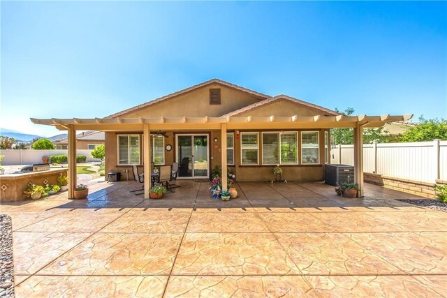1506 Pierce Ml, Beaumont, CA 92223 - back of house with a fenced backyard, a patio area, a pergola, and stucco siding