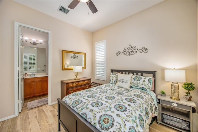 1506 Pierce Ml, Beaumont, CA 92223 - bedroom with light wood finished floors, multiple windows, ensuite bathroom, and a ceiling fan