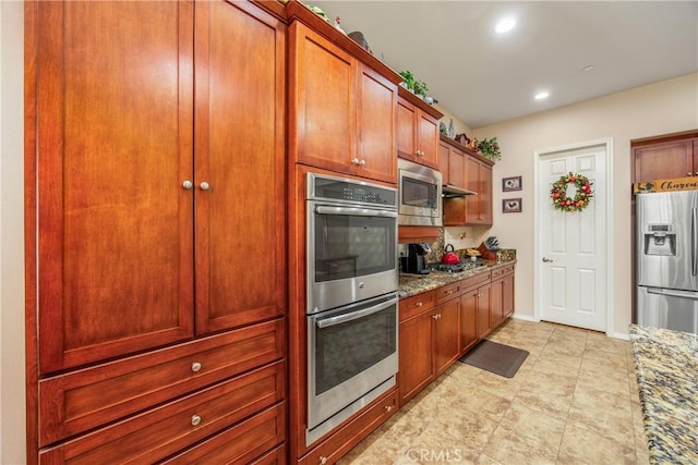 1506 Pierce Ml, Beaumont, CA 92223 - kitchen with appliances with stainless steel finishes, light stone counters, and recessed lighting
