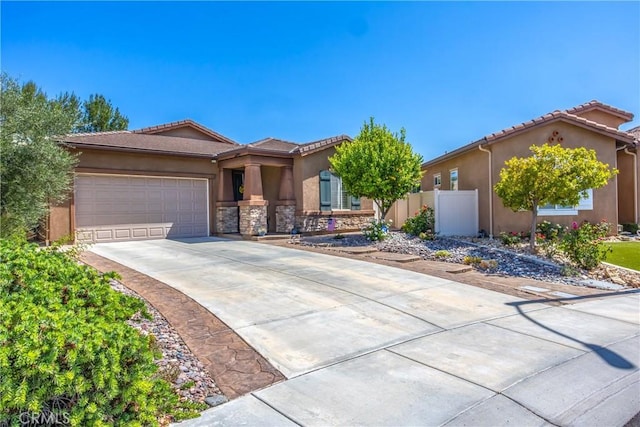 1506 Pierce Ml, Beaumont, CA 92223 - single story home with stucco siding, driveway, a garage, stone siding, and a tiled roof