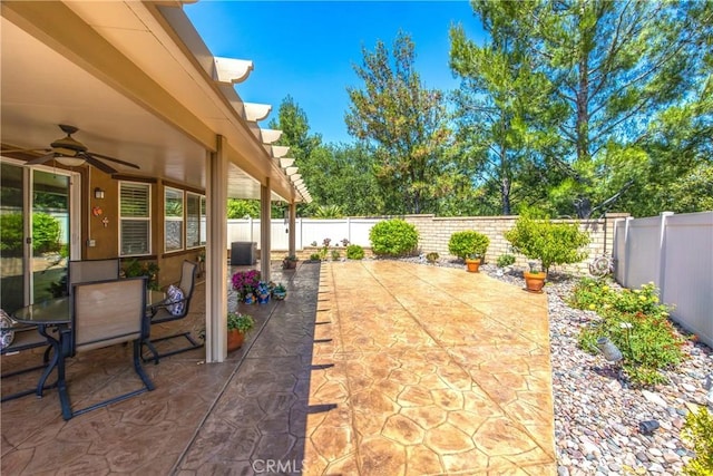1506 Pierce Ml, Beaumont, CA 92223 - fenced backyard with a ceiling fan and a patio