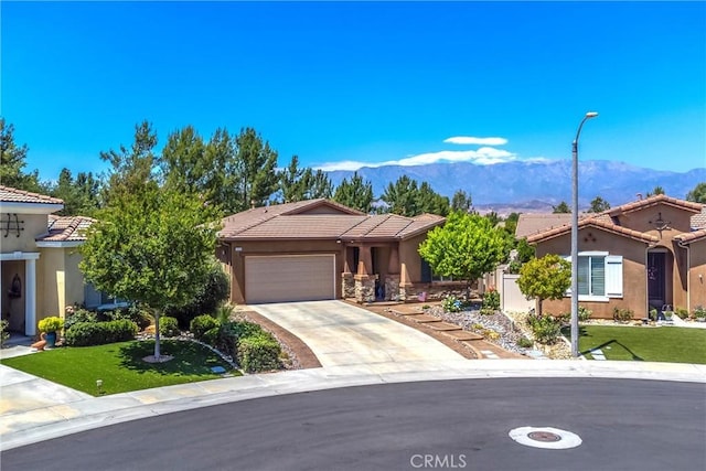 1506 Pierce Ml, Beaumont, CA 92223 - view of front of house featuring a mountain view, an attached garage, stucco siding, and a tiled roof
