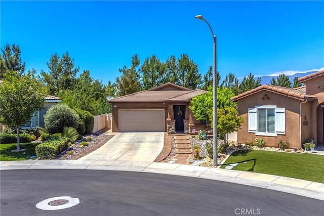 1506 Pierce Ml, Beaumont, CA 92223 - view of front of property featuring stucco siding, a garage, a tile roof, concrete driveway, and a mountain view