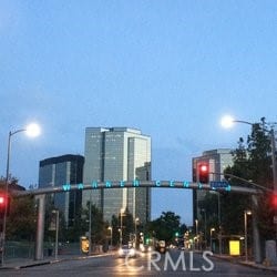 5800 Owensmouth Ave Unit 77, Woodland Hills, CA 91367 - view of asphalt street featuring street lights, traffic lights, and curbs