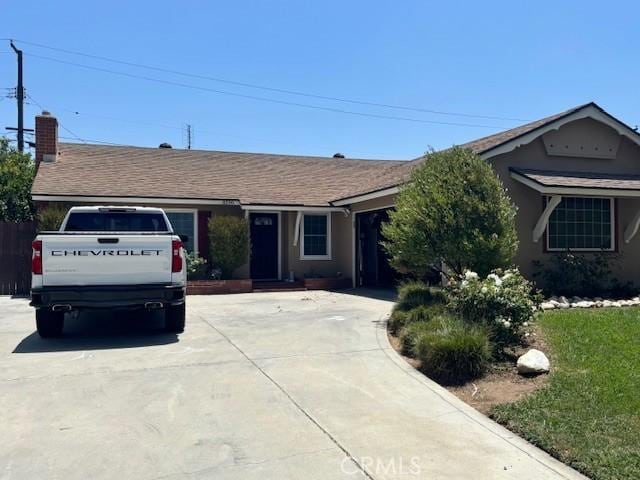 8596 Camelia Dr, Riverside, CA 92504 - ranch-style house with driveway and roof with shingles
