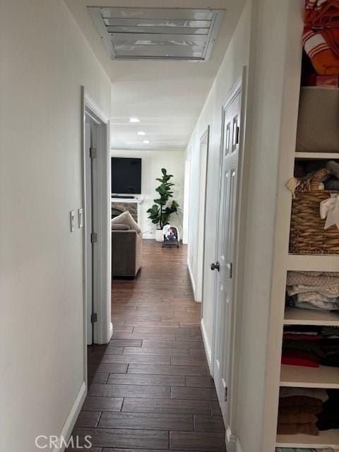 8596 Camelia Dr, Riverside, CA 92504 - hall featuring dark wood finished floors and baseboards