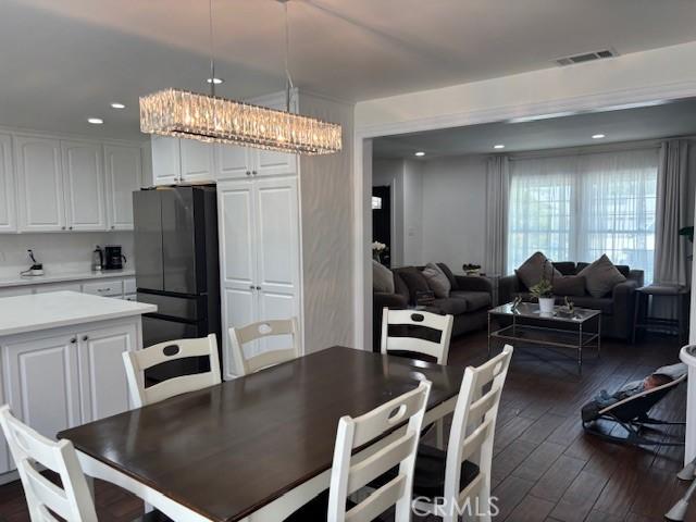 8596 Camelia Dr, Riverside, CA 92504 - dining area with dark wood-style flooring, recessed lighting, and a chandelier