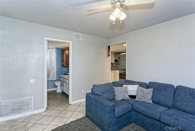 12164 Galaxy St, Victorville, CA 92392 - living area with light tile patterned floors and ceiling fan