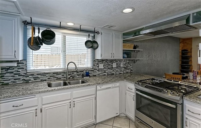 12164 Galaxy St, Victorville, CA 92392 - kitchen with dishwasher, stainless steel gas range, tasteful backsplash, open shelves, and a textured ceiling