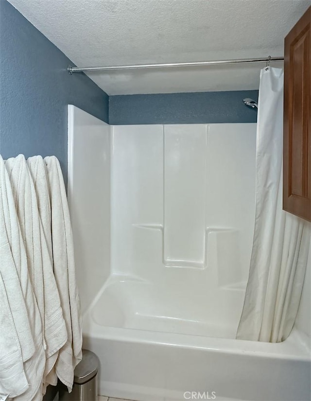 12164 Galaxy St, Victorville, CA 92392 - bathroom with a textured ceiling and shower / bath combination with curtain