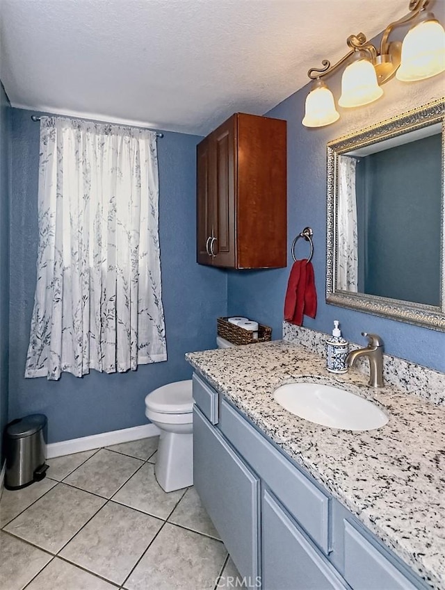 12164 Galaxy St, Victorville, CA 92392 - bathroom with vanity, tile patterned flooring, and a textured ceiling