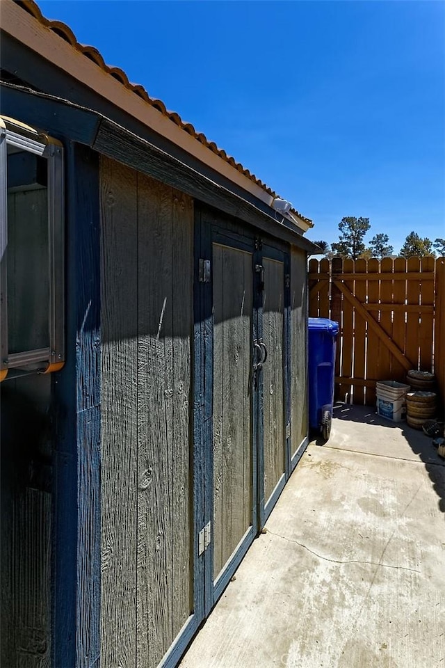 12164 Galaxy St, Victorville, CA 92392 - view of home's exterior featuring a tile roof and a gate