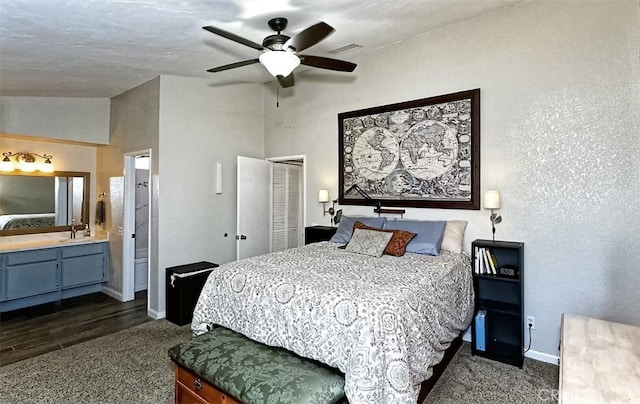 12164 Galaxy St, Victorville, CA 92392 - bedroom featuring dark colored carpet, a closet, connected bathroom, and ceiling fan