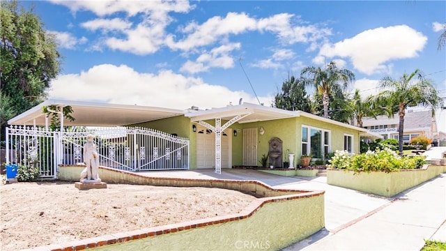 480 W D St, Colton, CA 92324 - view of front of home with stucco siding, a gate, and an attached garage