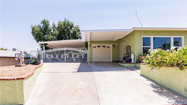 480 W D St, Colton, CA 92324 - view of front of home featuring concrete driveway, a carport, a gate, and a garage