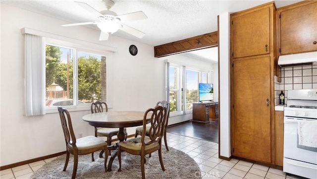 480 W D St, Colton, CA 92324 - dining room with plenty of natural light, light tile patterned flooring, and a ceiling fan