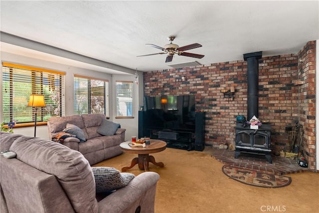 625 La Bonita Ct, Chico, CA 95973 - living area with a wood stove, carpet floors, a ceiling fan, and brick wall