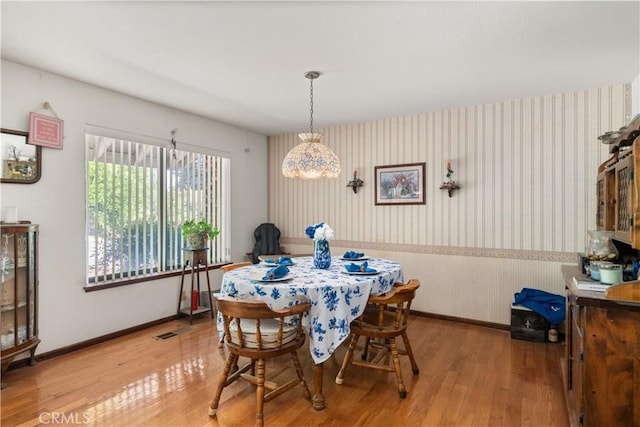 625 La Bonita Ct, Chico, CA 95973 - dining space with wallpapered walls and wood finished floors