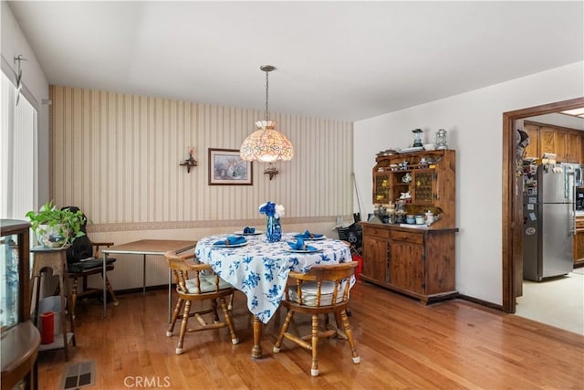 625 La Bonita Ct, Chico, CA 95973 - dining space with wallpapered walls and light wood-type flooring