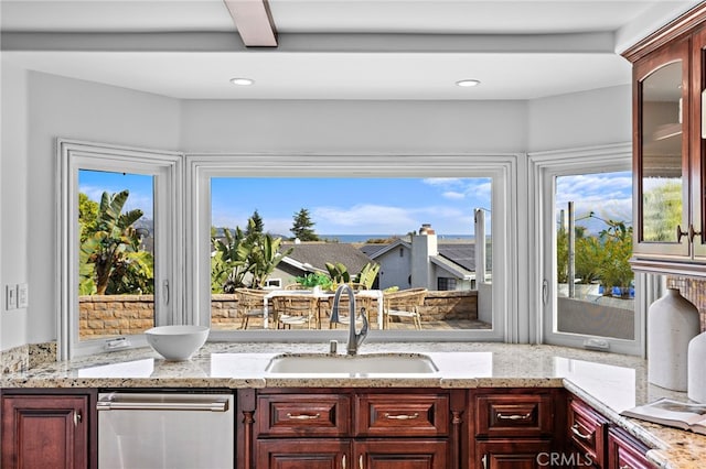 609 Calle Reata, San Clemente, CA 92673 - kitchen featuring dishwasher, dark brown cabinets, healthy amount of natural light, and recessed lighting