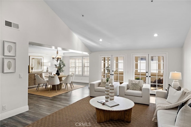 609 Calle Reata, San Clemente, CA 92673 - living room featuring french doors, recessed lighting, dark wood-style floors, high vaulted ceiling, and a chandelier