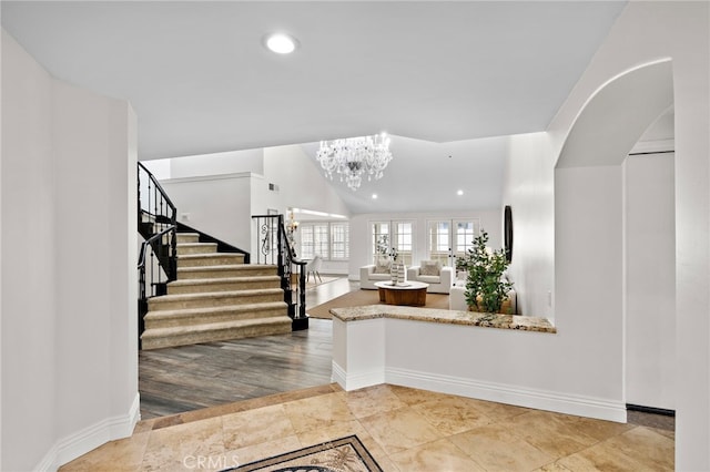 609 Calle Reata, San Clemente, CA 92673 - entrance foyer featuring stairway, recessed lighting, a chandelier, and arched walkways