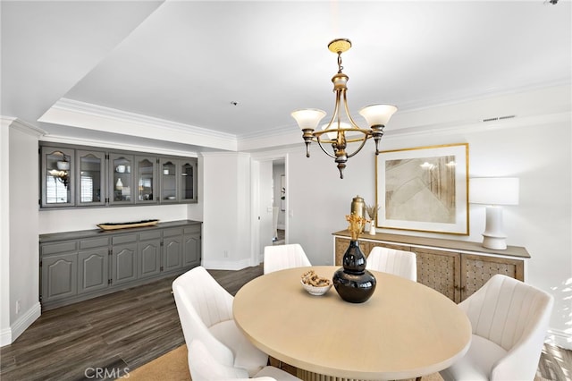 609 Calle Reata, San Clemente, CA 92673 - dining space with a chandelier, dark wood-type flooring, and ornamental molding