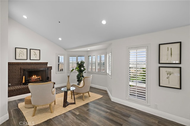 609 Calle Reata, San Clemente, CA 92673 - sitting room featuring a brick fireplace, dark wood finished floors, vaulted ceiling, and recessed lighting