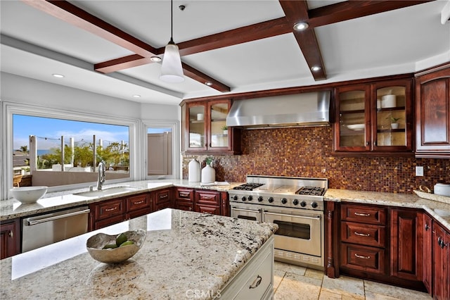 609 Calle Reata, San Clemente, CA 92673 - kitchen with stainless steel appliances, wall chimney range hood, tasteful backsplash, hanging light fixtures, and dark brown cabinets