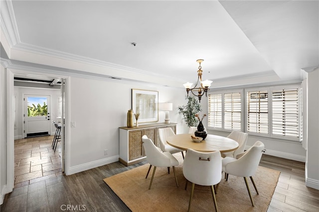 609 Calle Reata, San Clemente, CA 92673 - dining room with a tray ceiling, a chandelier, ornamental molding, and wood finished floors