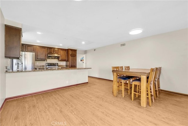 20530 Divonne Dr, Walnut, CA 91789 - kitchen with stainless steel fridge, light wood-type flooring, a peninsula, stove, and recessed lighting