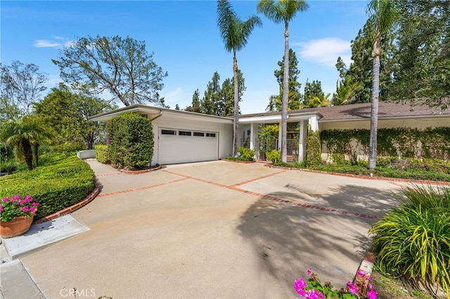 11071 Coronel, North Tustin, CA 92705 - view of front of house with an attached garage and concrete driveway