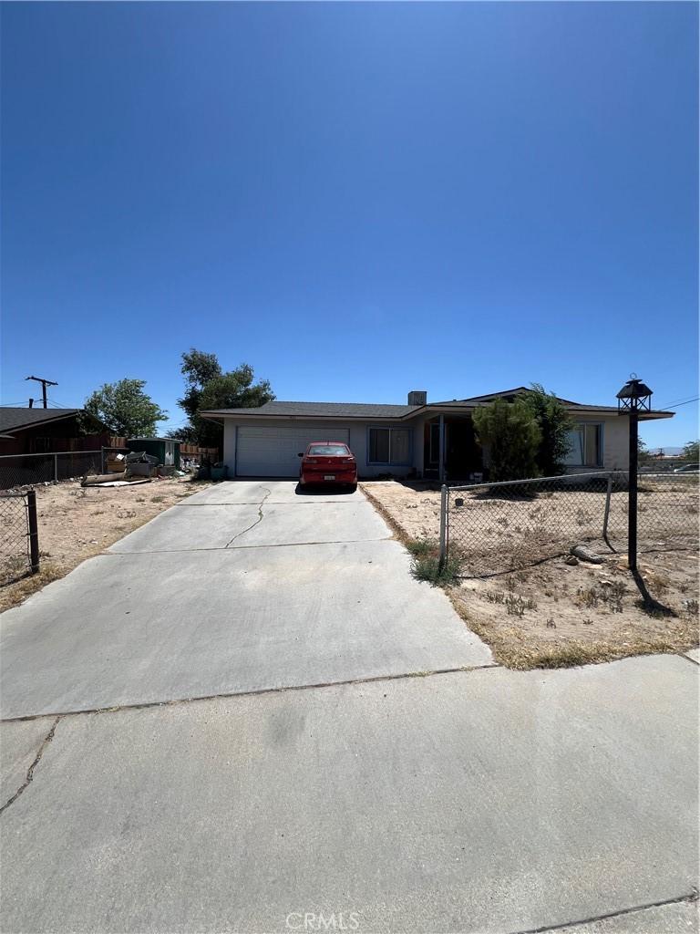 14311 Manzanita Rd, Victorville, CA 92395 - ranch-style house featuring driveway and an attached garage