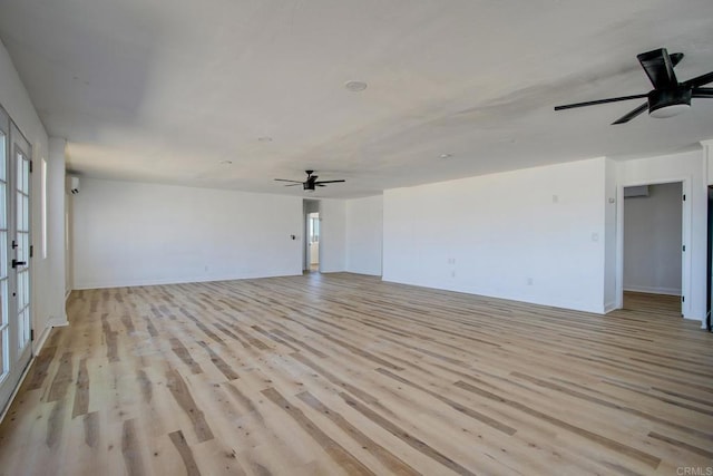 5655 Last Mile Rd, Johnson Valley, CA 92285 - unfurnished living room featuring a ceiling fan, light wood finished floors, and plenty of natural light
