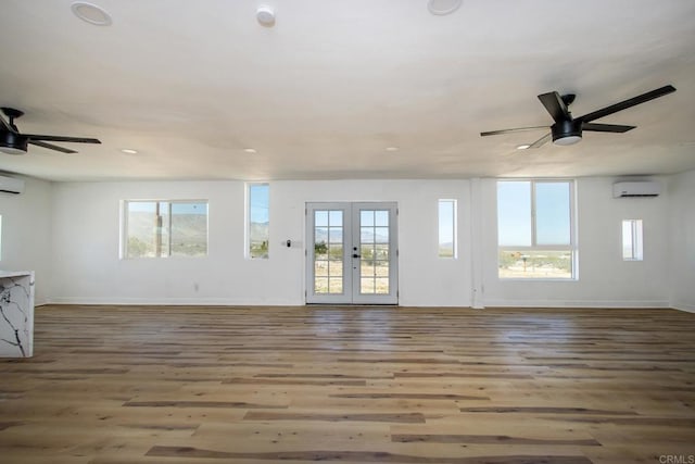 5655 Last Mile Rd, Johnson Valley, CA 92285 - unfurnished living room with a ceiling fan, a wall unit AC, plenty of natural light, wood finished floors, and recessed lighting