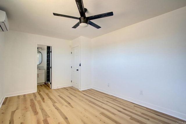 5655 Last Mile Rd, Johnson Valley, CA 92285 - spare room with ceiling fan, light wood-style flooring, and a wall mounted air conditioner
