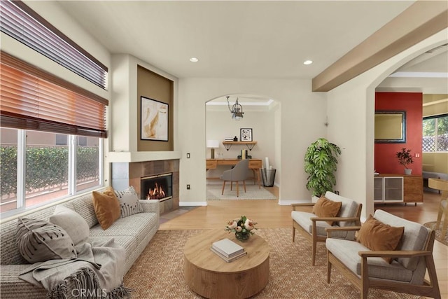 5242 Vesper Ave Unit 7, Sherman Oaks, CA 91411 - living area featuring arched walkways, recessed lighting, wood finished floors, and a tile fireplace