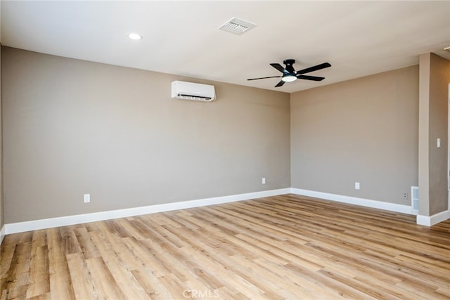 73570 Cedar Dr Unit 29, Palms, CA 92277 - empty room featuring a wall mounted AC, ceiling fan, light wood finished floors, and recessed lighting