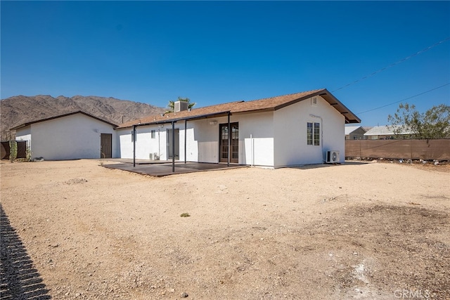 73570 Cedar Dr Unit 29, Palms, CA 92277 - rear view of house with a patio area, stucco siding, and a mountain view