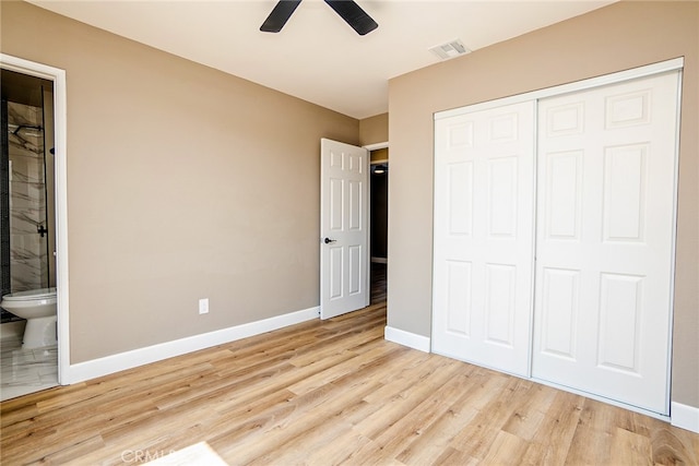 73570 Cedar Dr Unit 29, Palms, CA 92277 - unfurnished bedroom featuring light wood-style floors, a closet, ensuite bath, and a ceiling fan
