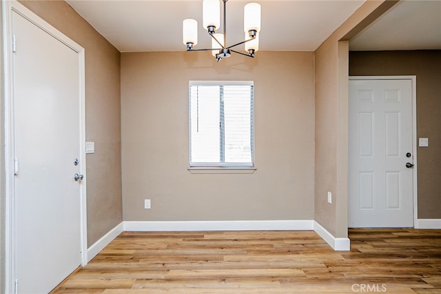73570 Cedar Dr Unit 29, Palms, CA 92277 - unfurnished dining area featuring a chandelier and wood finished floors
