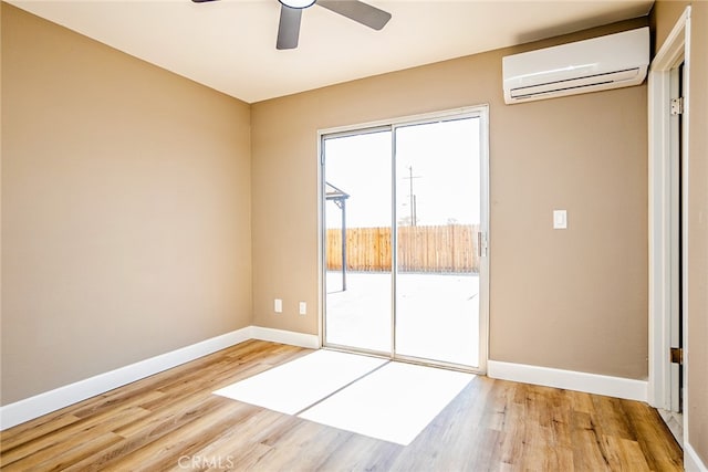 73570 Cedar Dr Unit 29, Palms, CA 92277 - unfurnished room featuring a wall mounted air conditioner, wood finished floors, and ceiling fan
