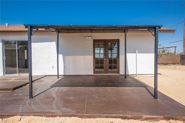 73570 Cedar Dr Unit 29, Palms, CA 92277 - back of house with stucco siding, french doors, and a patio