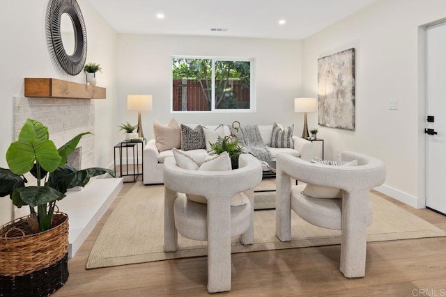 5461 Waring Rd, San Diego, CA 92120 - living area with wood finished floors, recessed lighting, and a fireplace