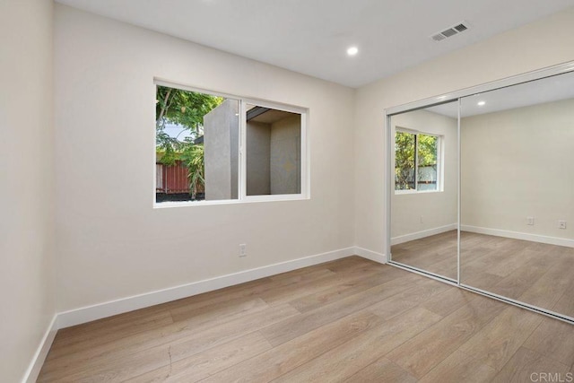 5461 Waring Rd, San Diego, CA 92120 - unfurnished bedroom with wood finished floors, recessed lighting, and a closet