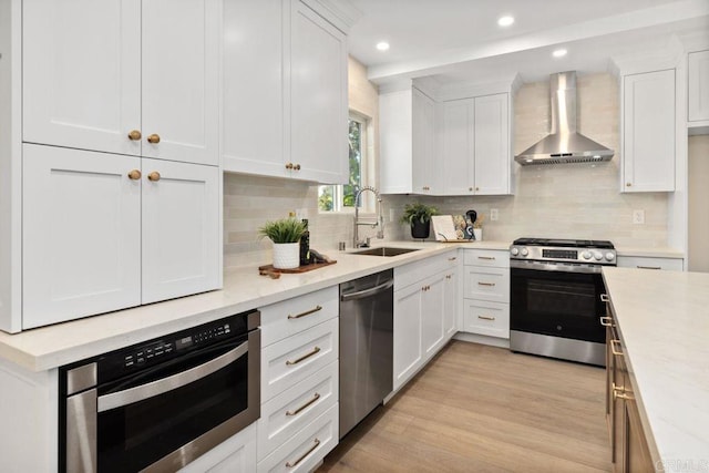 5461 Waring Rd, San Diego, CA 92120 - kitchen with wall chimney exhaust hood, stainless steel appliances, white cabinets, light countertops, and tasteful backsplash