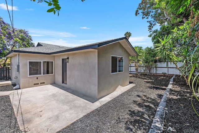 5461 Waring Rd, San Diego, CA 92120 - rear view of house with stucco siding, a fenced backyard, a patio, and roof with shingles