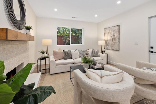 5461 Waring Rd, San Diego, CA 92120 - living area with light wood finished floors, recessed lighting, and a fireplace