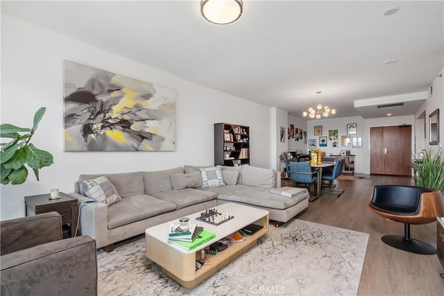 3785 Wilshire Blvd Unit 1605, Los Angeles, CA 90010 - living room featuring a chandelier and wood finished floors