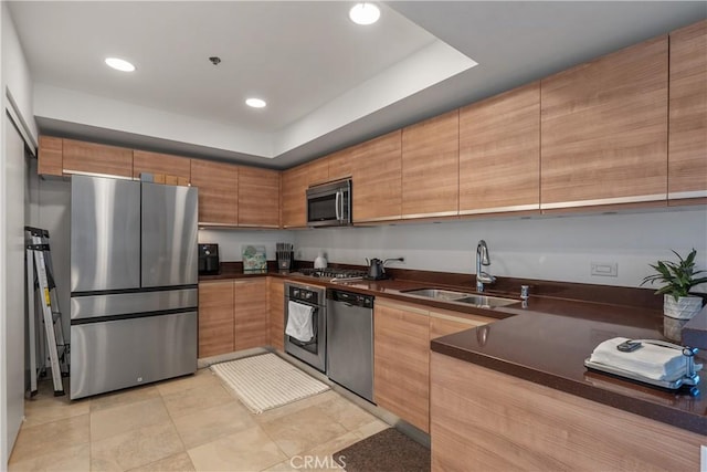 3785 Wilshire Blvd Unit 1605, Los Angeles, CA 90010 - kitchen featuring appliances with stainless steel finishes, dark countertops, modern cabinets, recessed lighting, and brown cabinets